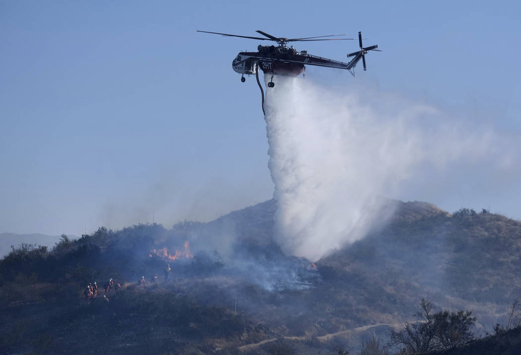 Firefighters battle the Easy Fire in Simi Valley, Calif., near the Ronald Reagan Presidential L ...