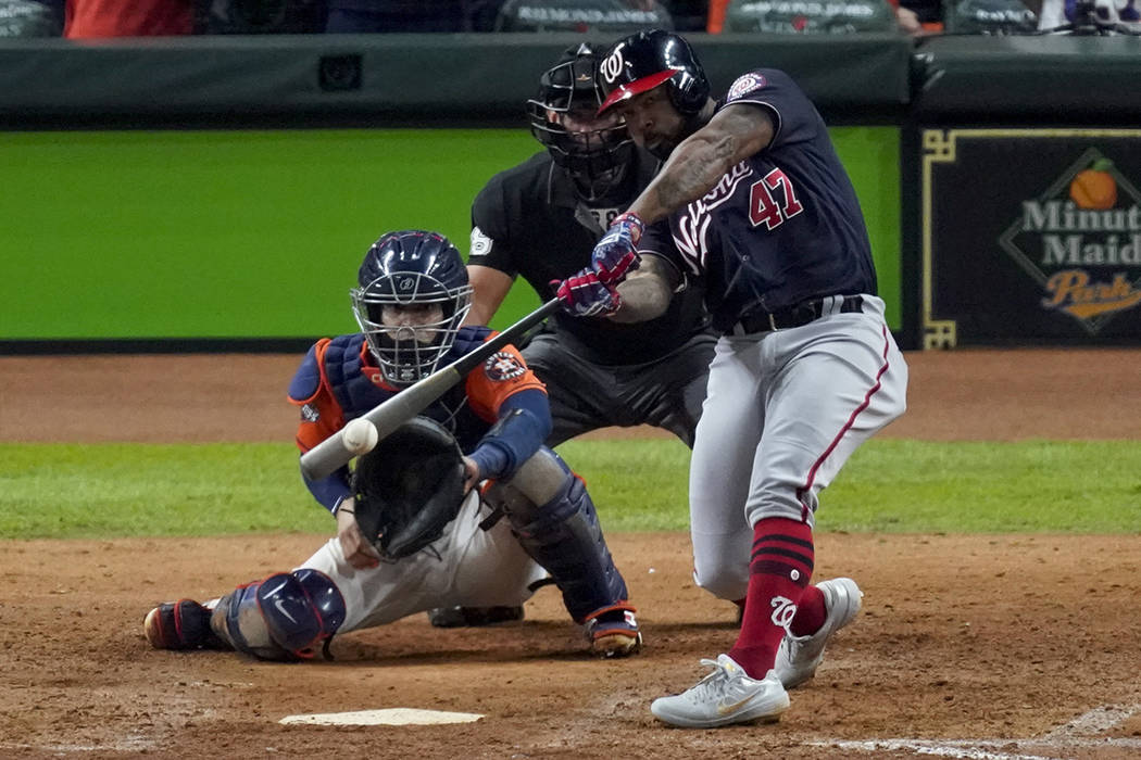 Washington Nationals' Howie Kendrick hits a two-run home run against the Houston Astros during ...