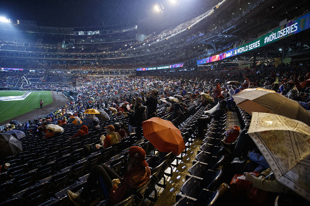 Washington Nationals fans watch television coverage of Game 7 of the baseball World Series in t ...