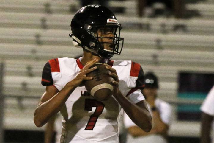 Las Vegas High's quarterback Ja'shawn Scroggins sets up to pass the ball during the first half ...