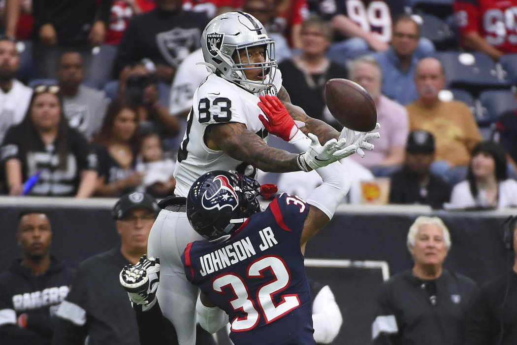 Houston Texans cornerback Lonnie Johnson (32) breaks up a pass intended for Oakland Raiders tig ...