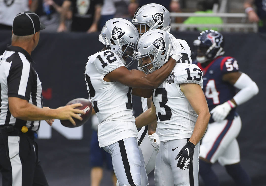 Oakland Raiders wide receiver Hunter Renfrow (13) celebrates his 65-yard touchdown catch agains ...