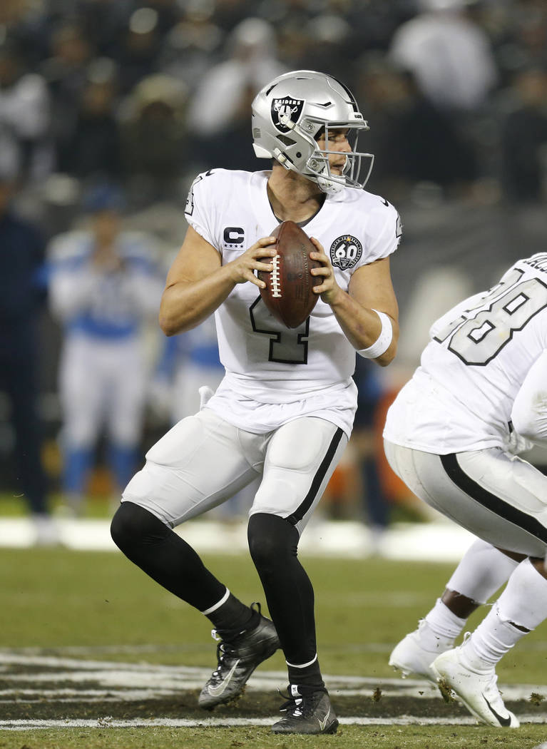 Oakland Raiders quarterback Derek Carr (4) passes against the Los Angeles Chargers during an NF ...