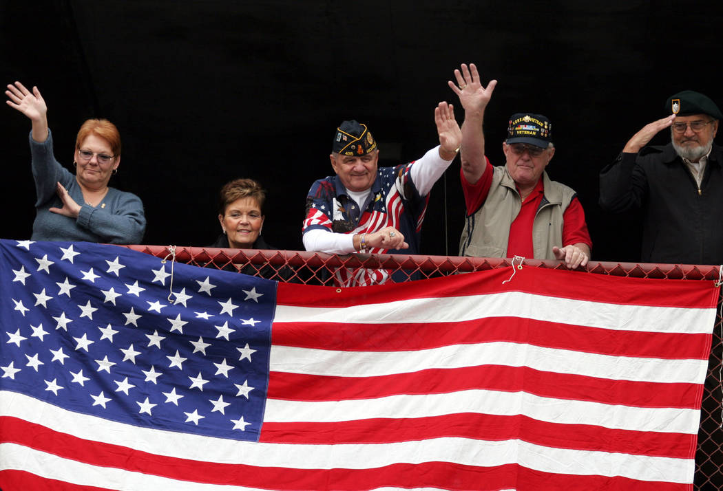 Parade goers, from left, Jeannine Holland, Jordy Wolf, Nick Wolf, John Holland and Pieter Kromm ...