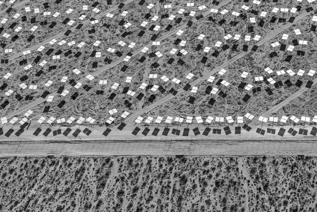 Heliostats near the boundary of Unit 3. "The Evolution of Ivanpah Solar," featuring photographs ...