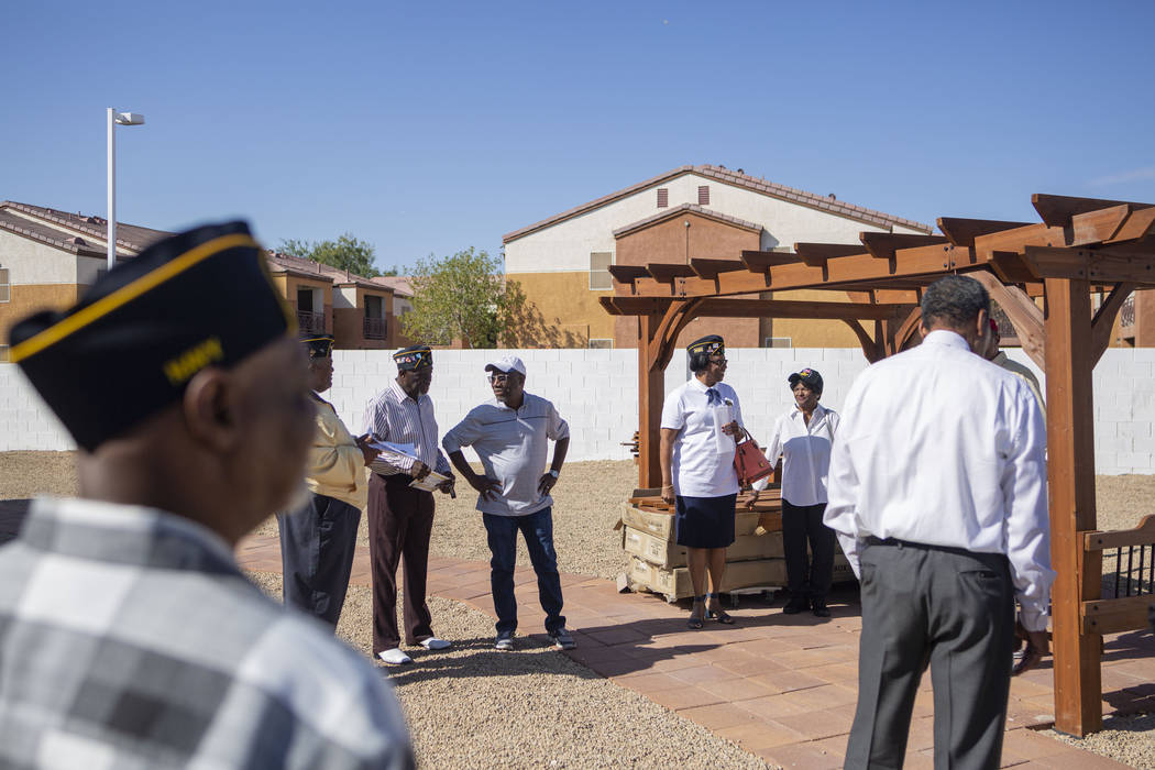 American Legion Post 10 members converse in the newly renovated patio funded by a grant provid ...