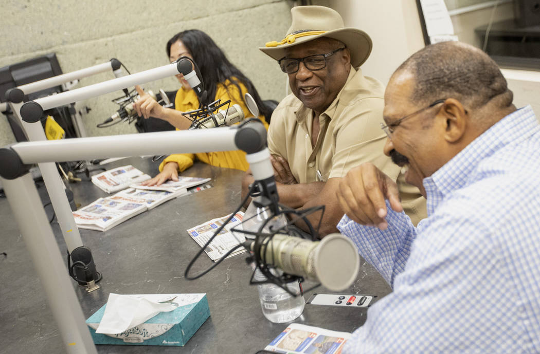 Su Phelps, Sammy R. Armstrong and Lionel Charles laugh during 88.1 FM's radio show at the KCEP ...