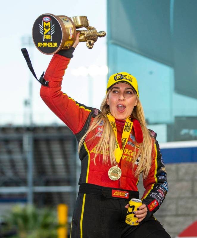 Top Fuel racer Brittany Force celebrates her win in the final round of the Dodge NHRA Nationals ...