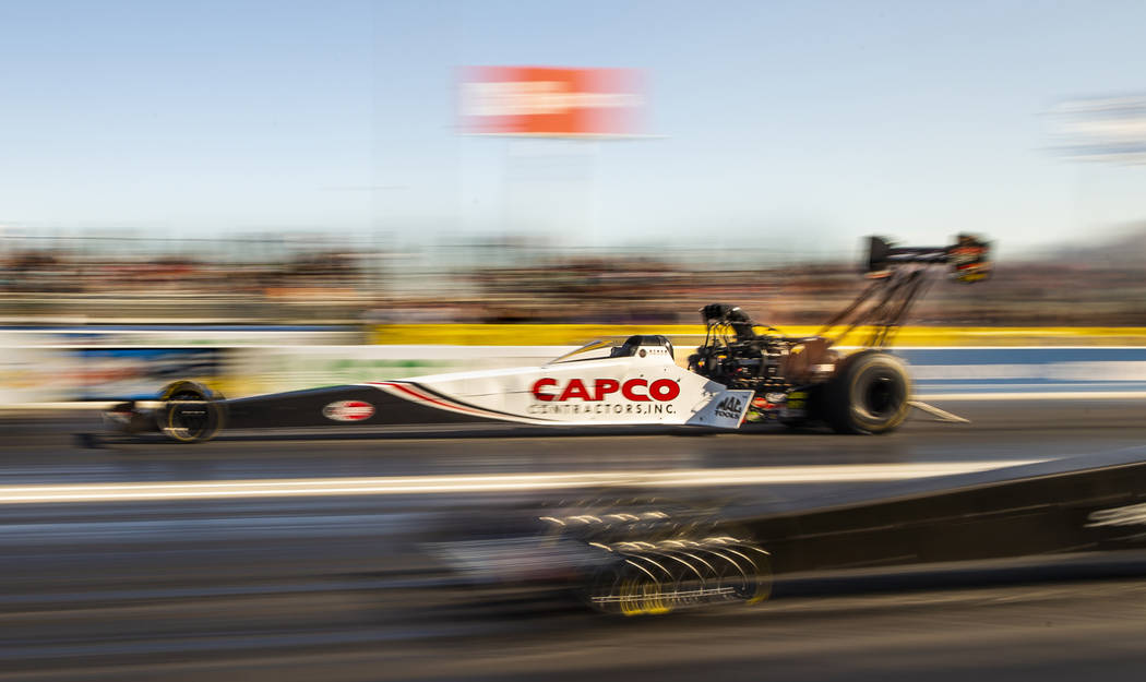 Top Fuel racer Steve Torrence surges ahead during the second round of the Dodge NHRA Nationals ...