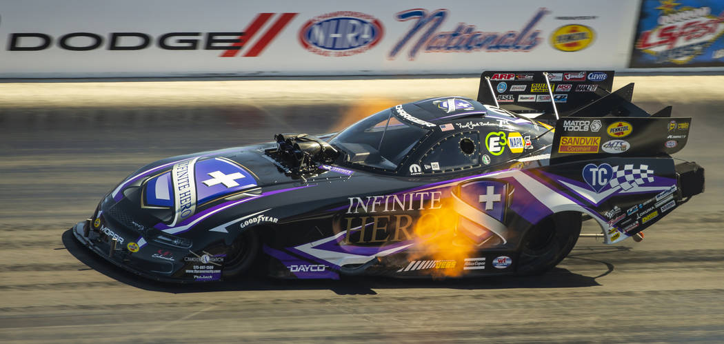 Funny Car racer Jack Beckman gets on the gas during the first round of the Dodge NHRA Nationals ...