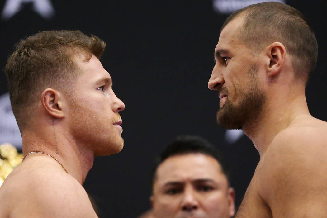 Saul "Canelo" Alvarez, left, and Sergey Kovalev pose during a weigh-in event at the M ...