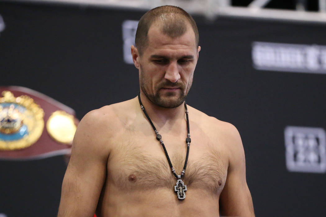 Sergey Kovalev stands on the scale during a weigh-in event at the MGM Grand Garden Arena in Las ...