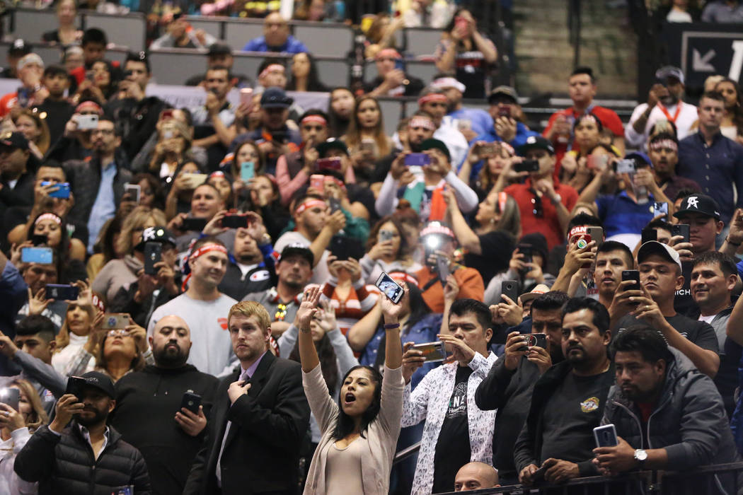 People attend the weigh-in for Saul "Canelo" Alvarez and Sergey Kovalev at the MGM Gr ...