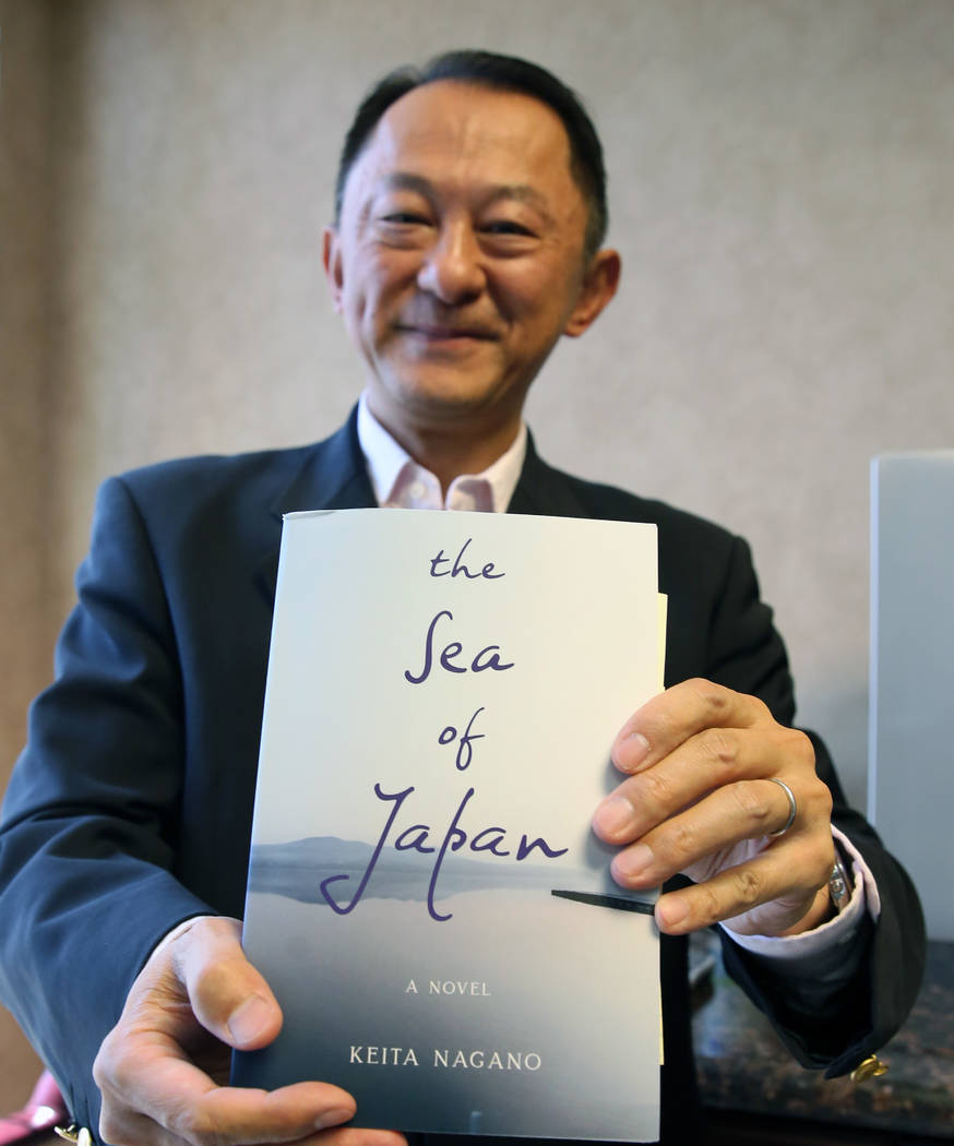 Keita Nagano, an author of "The Sea of Japan," poses for photo at his Henderson offic ...