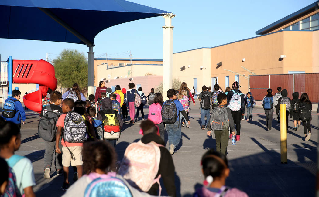 Students arrive at the start of the school day at Manch Elementary in Las Vegas Tuesday, Oct. 2 ...
