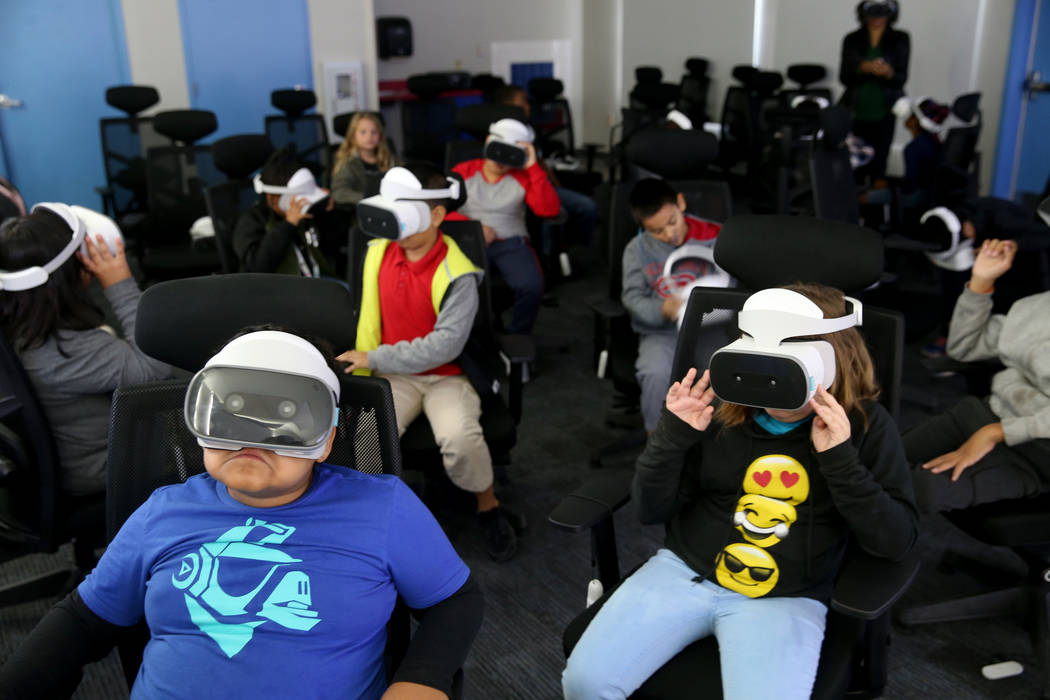 Students in Franchester Dailey's fourth grade class swim with sharks in the virtual realty lab ...