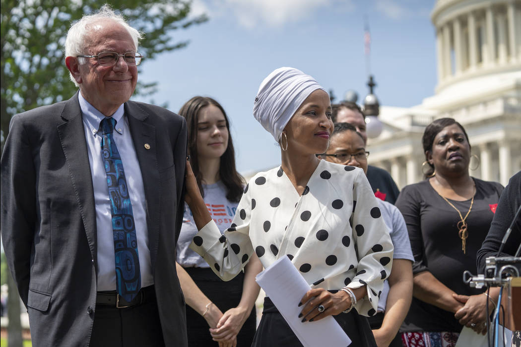 Democratic presidential candidate, Sen. Bernie Sanders, I-Vt., left, and Rep. Ilhan Omar, D-Min ...