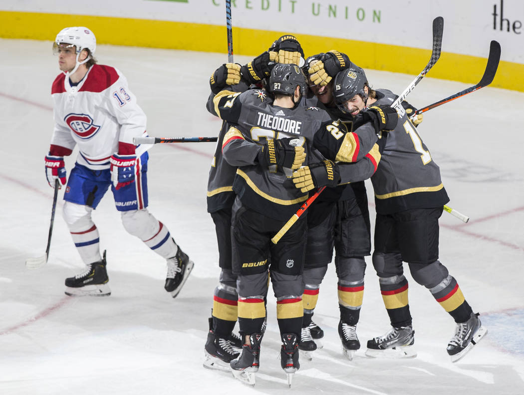 Vegas Golden Knights defenseman Shea Theodore (27) and Vegas Golden Knights defenseman Jon Merr ...