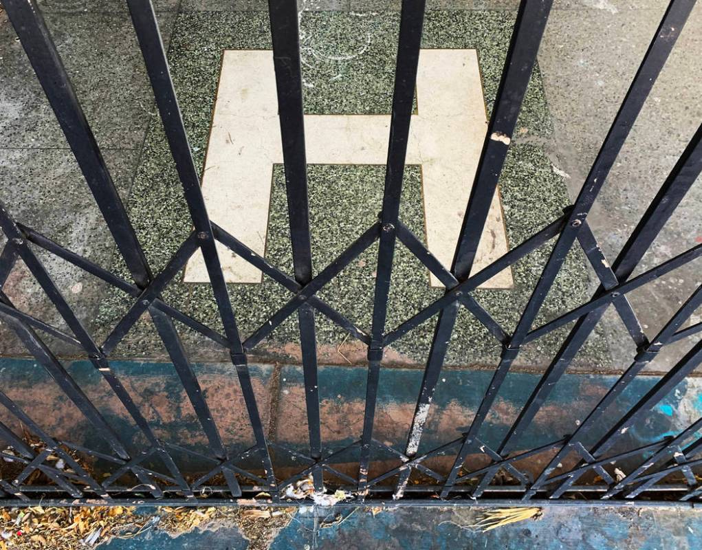 An H-shaped tile greets visitors outside the main entrance of the historic Huntridge Theater on ...