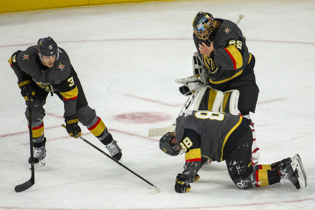 Vegas Golden Knights defenseman Nate Schmidt (88) is down injured on the ice versus the San Jos ...