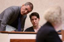 Giovanni Ruiz, 21, second from left, talks to his attorney, Gabriel Grasso, while waiting to ap ...