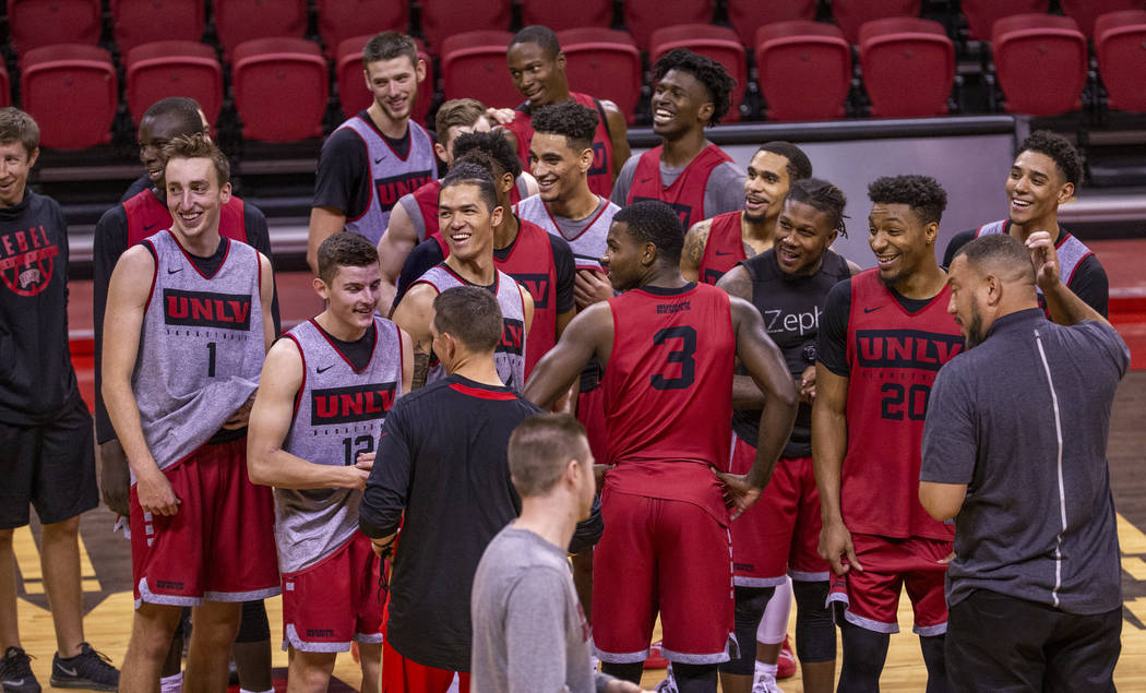 UNLV basketball players come together to welcome a guest at the end of practice in the Thomas & ...