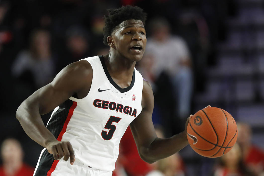 Georgia's Anthony Edwards (5) dribbles the ball up during an NCAA college basketball exhibition ...