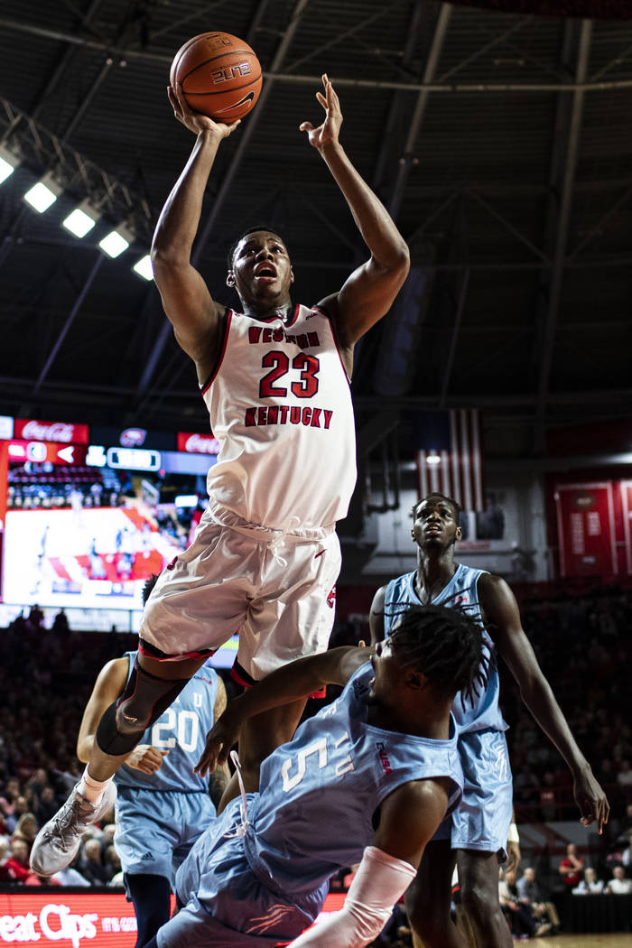 Western Kentucky center Charles Bassey (23) is called for an offensive foul against Florida Int ...