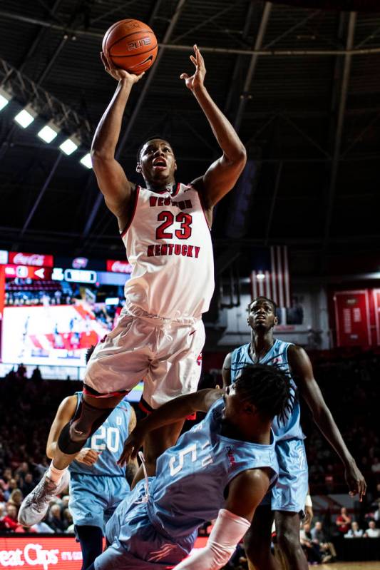 Western Kentucky center Charles Bassey (23) is called for an offensive foul against Florida Int ...