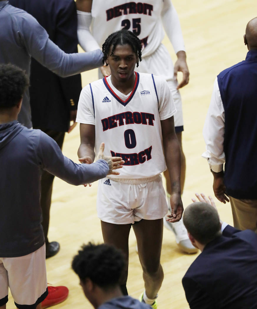 Detroit Mercy guard Antoine Davis walks to the bench after breaking Steph Curry's NCAA record f ...