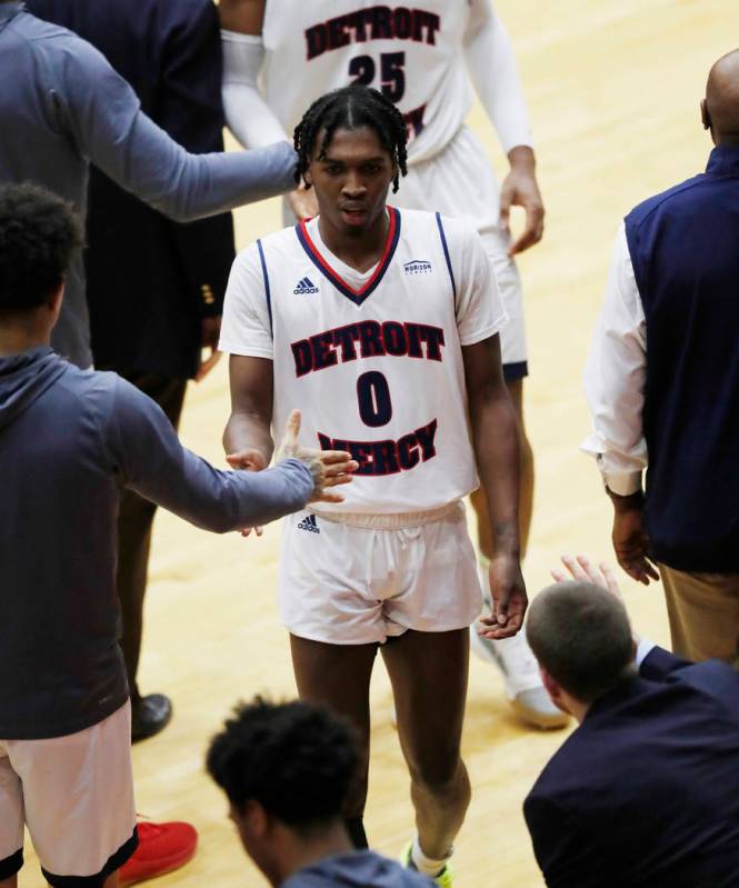 Detroit Mercy guard Antoine Davis walks to the bench after breaking Steph Curry's NCAA record f ...