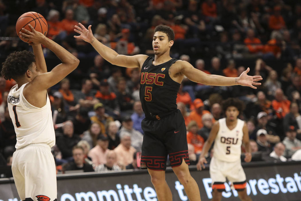 Southern California's Derryck Thornton defends against Oregon State's Stephen Thompson Jr. duri ...