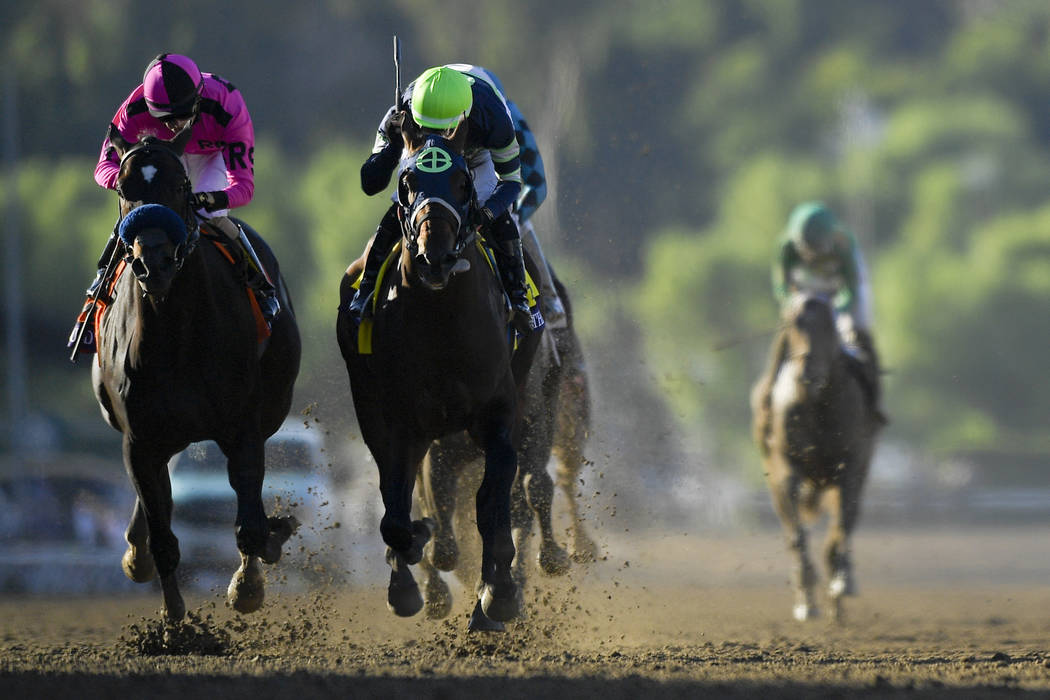 Storm the Court, right, with Flavien Prat, edges out Anneau D'or for the win in the Breeders' C ...