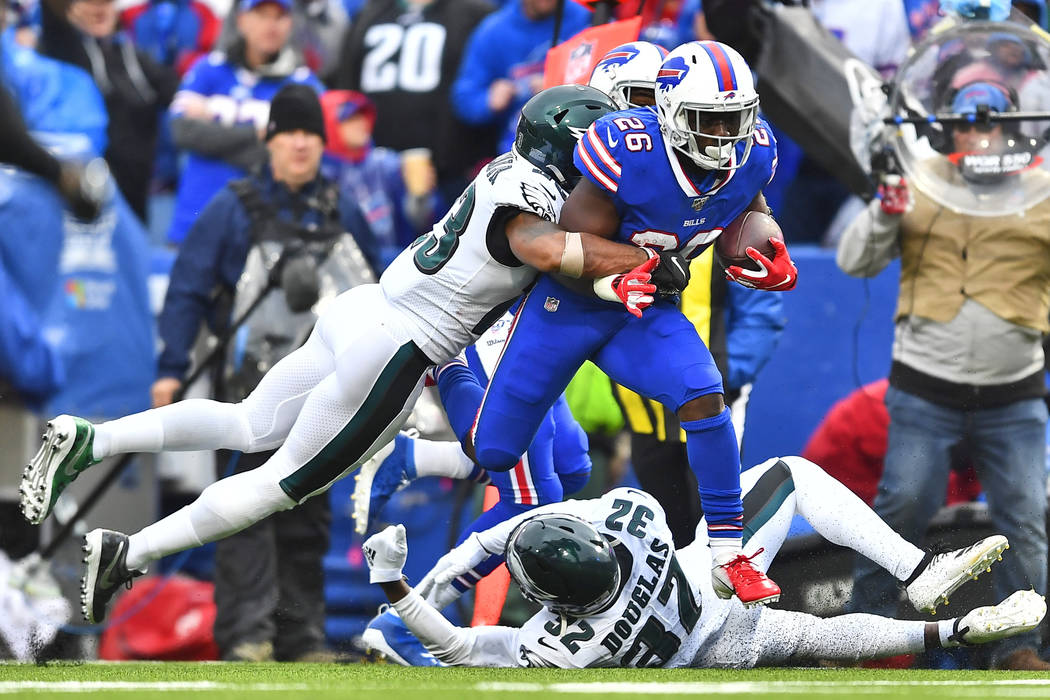 Buffalo Bills' Devin Singletary (26), center, breaks tackles to score a touchdown during the se ...