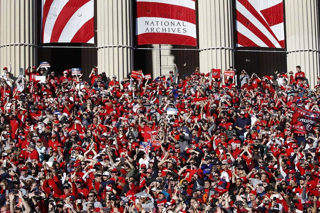 Washington Nationals fans gather on the steps of the National Archives during a parade to celeb ...