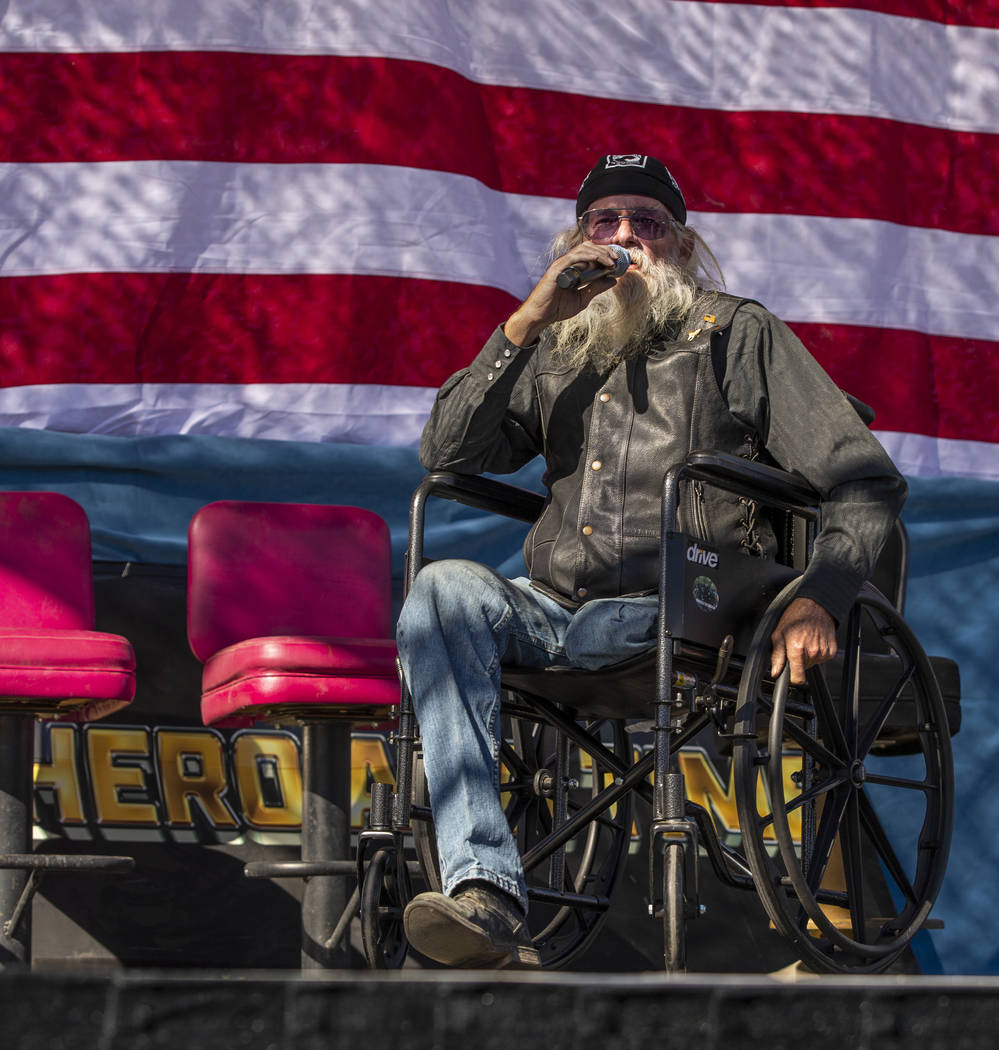 Daniel "Lt. Dan" Holman sings the National Anthem during the 10th Annual One Hero at ...