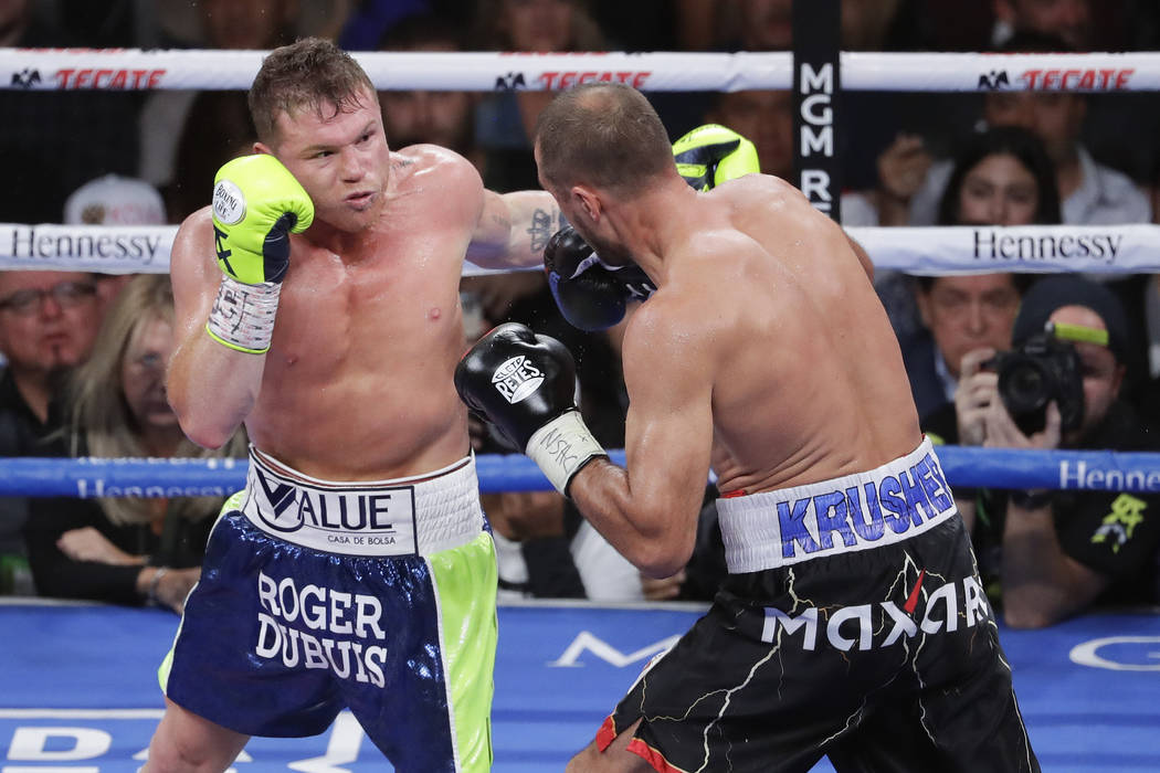 Saul “Canelo” Alvarez, left, knocks out Sergey Kovalev during the 11th round of the WBO lig ...