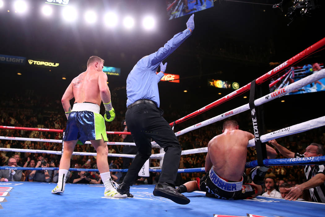 Saul “Canelo” Alvarez, left, knocks out Sergey Kovalev during the 11th round of the WBO lig ...