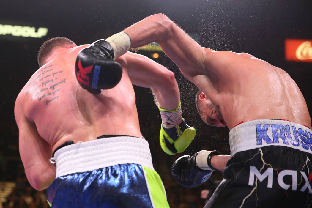 Saul “Canelo” Alvarez, left, connects a punch against Sergey Kovalev during the 1 ...