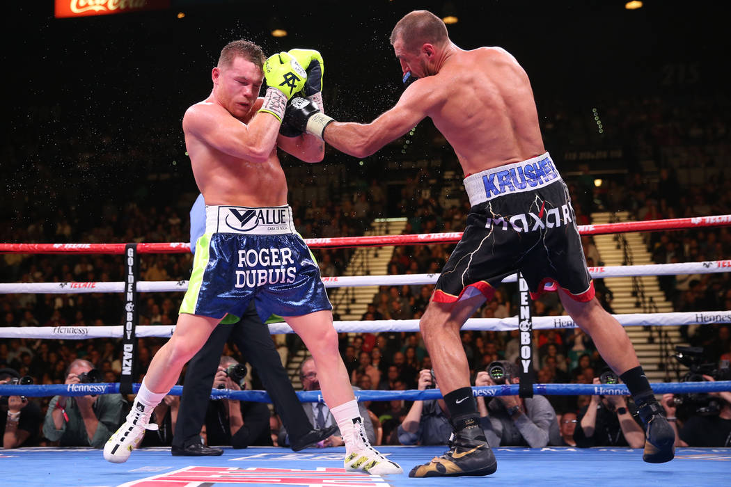 Saul “Canelo” Alvarez, left, battles Sergey Kovalev during the ninth round of the ...