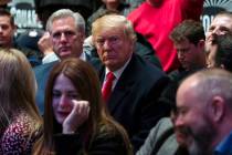 President Donald Trump sits at Madison Square Garden for the UFC 244 mixed martial arts fights, ...