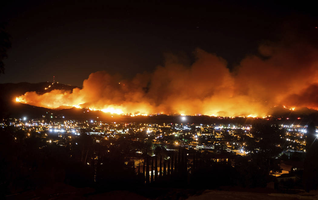 FILE - In this Oct. 31, 2019 file photo smoke from the Maria Fire billows above Santa Paula, Ca ...