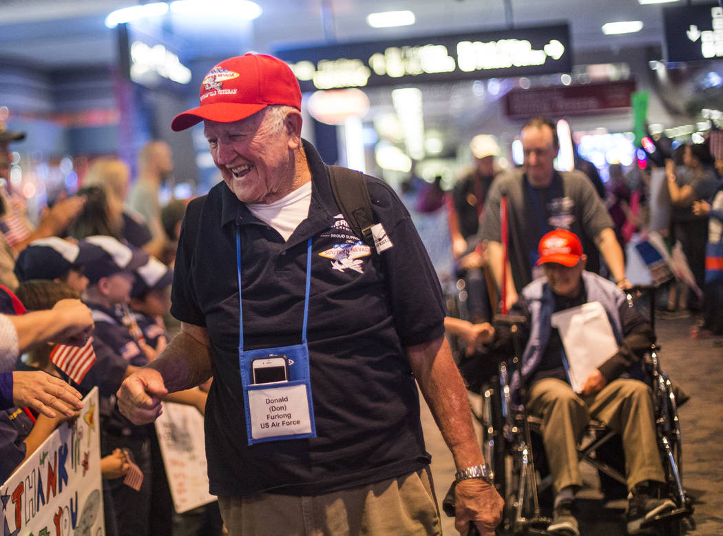 Don Furlong, a veteran of the U.S. Air Force, greets supporters after visiting the veteran memo ...