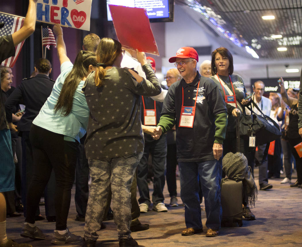 Rollie Tatro, a veteran of the U.S. Air Force, greets supporters after visiting the veteran mem ...