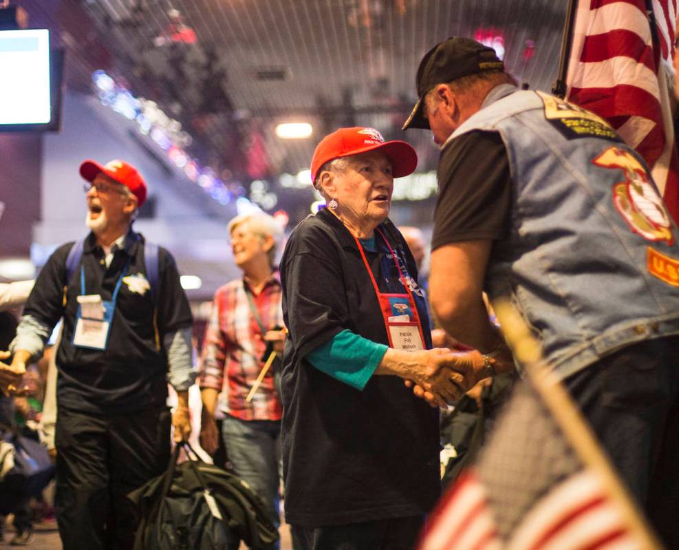 Patricia Whitlock, a veteran of the U.S. Navy, greets supporters after visiting the veteran mem ...