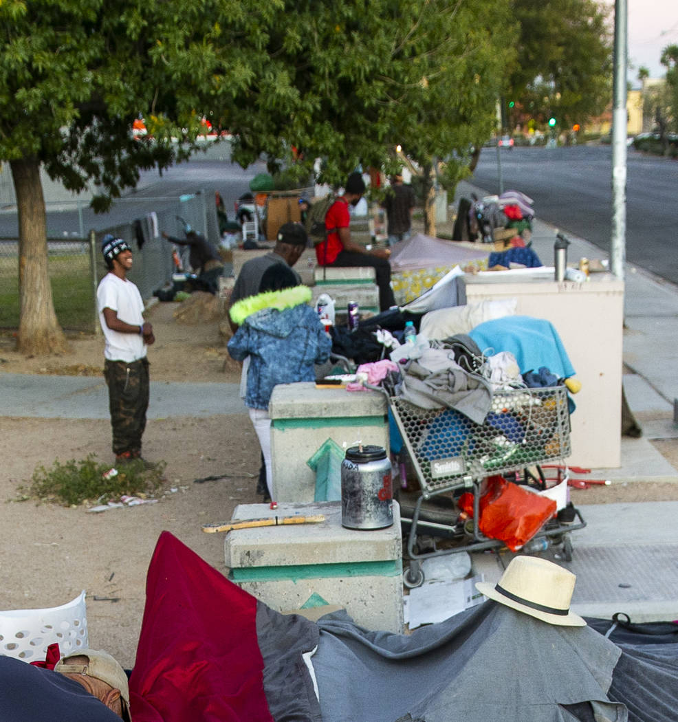 A myriad of possessions are gathered about a homeless encampment at Molasky Family Park off E. ...