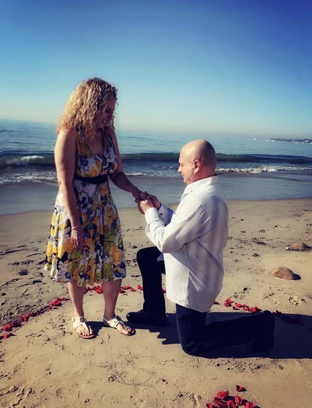 John Di Domenico and Michele Rothstein are shown on the beach in Santa Barbara, Calif., as Di D ...