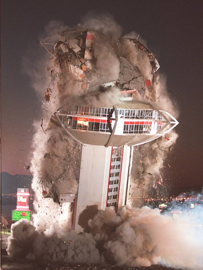 The tower of the Landmark hotel-casino comes crashing down during a planned implosion of the ic ...