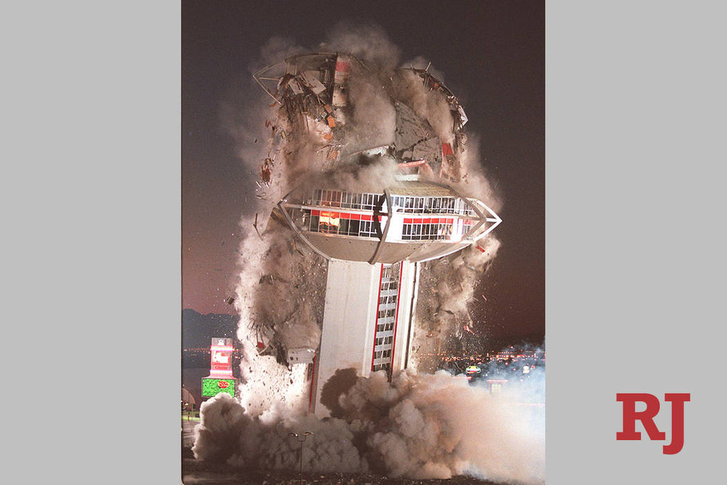 The tower of the Landmark hotel- casino comes crashing down during a planned implosion of the i ...