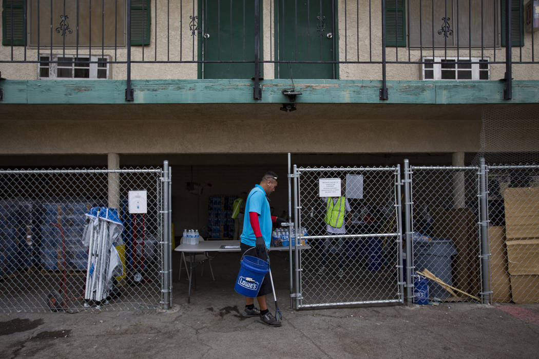 Harlan Thompson goes about his duties at the Courtyard Homeless Resource Center in Las Vegas, T ...